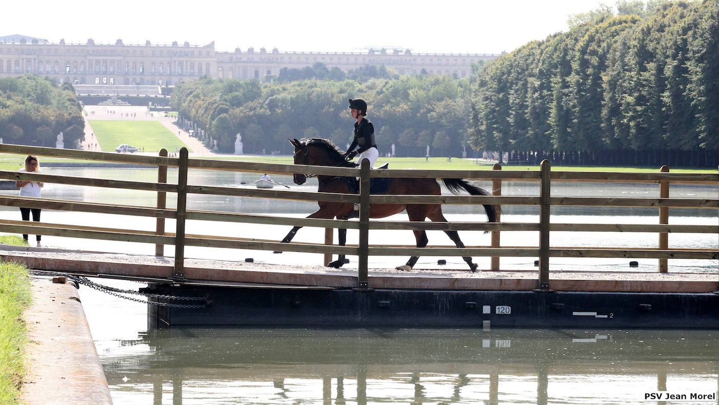 Horses gallop over pontoon on Grand Canal at Versailles in Paris 2024 test